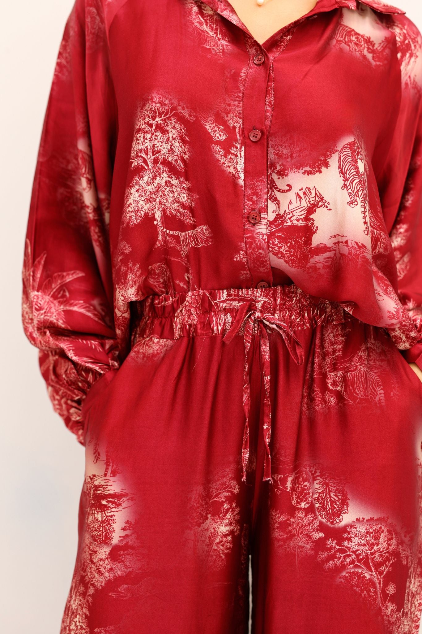 Red patterned outfit on a plain background